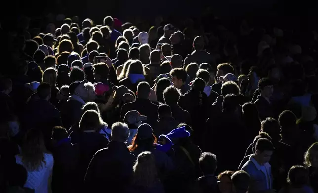 People in the crowd listen to performers during a campaign rally supporting Democratic presidential nominee Vice President Kamala Harris outside the Philadelphia Museum of Art, Monday, Nov. 4, 2024, in Philadelphia. (AP Photo/Matt Slocum)