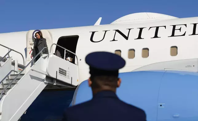 Democratic presidential nominee Vice President Kamala Harris steps off Air Force Two as she arrives in Madison, Wis., Friday, Nov. 1, 2024. (AP Photo/Charles Rex Arbogast)