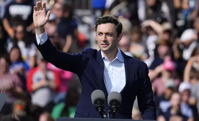 Sen. Jon Ossoff, D-Ga., arrives to speak at a campaign rally for Democratic presidential nominee Vice President Kamala Harris outside the Atlanta Civic Center, Saturday, Nov. 2, 2024. (AP Photo/Brynn Anderson)