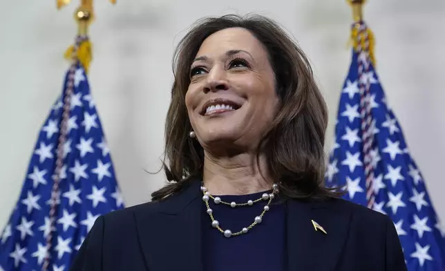 Democratic presidential nominee Vice President Kamala Harris speaks with reporters after attending a service at the Church of Christian Compassion, Sunday, Oct. 27, 2024, in Philadelphia. (AP Photo/Susan Walsh)