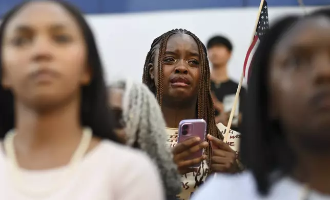 A supporter of Vice President Kamala Harris reacts as she delivers a concession speech for the 2024 presidential election on the campus of Howard University, Wednesday, Nov. 6, 2024, in Washington. (AP Photo/Terrance Williams)