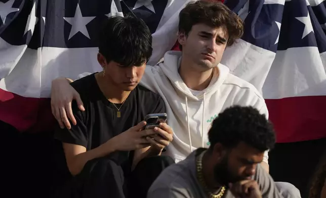 Supporters wait for Vice President Kamala Harris to arrive to deliver a concession speech for the 2024 presidential election on the campus of Howard University in Washington, Wednesday, Nov. 6, 2024. (AP Photo/Ben Curtis)