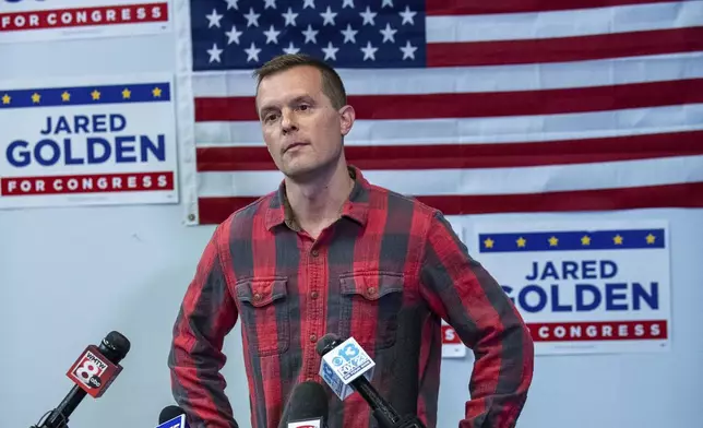 Rep. Jared Golden, D-Maine, fields a question from the media Wednesday afternoon, Nov. 6, 2024, during a press conference at his campaign office in Lewiston, Maine. (Russ Dillingham/Sun Journal via AP)