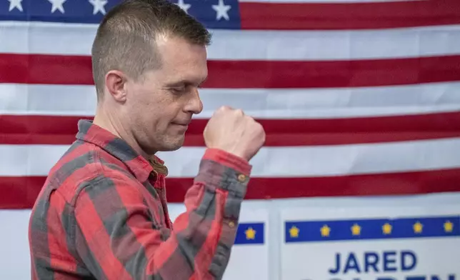 Rep. Jared Golden, D-Maine, gestures as he walks to the podium to address the media Wednesday afternoon, Nov. 6, 2024, during a press conference at his campaign office in Lewiston, Maine. (Russ Dillingham/Sun Journal via AP)