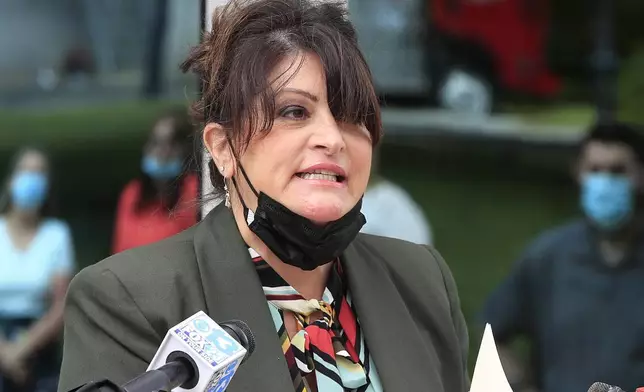 FILE - Maine GOP Chair Dr. Demi Kouzounas speaks about efforts to repeal ranked choice voting at a news conference outside the State House, Monday, June 15, 2020, in Augusta, Maine. Demi is running for the U.S. Senate in Maine(AP Photo/Robert F. Bukaty, File)