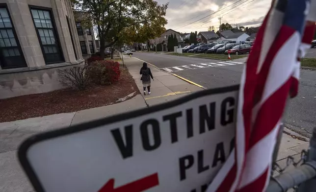 A voter leaves a polling site after casting a ballot on Election Day, Tuesday, Nov. 5, 2024, in Dearborn, Mich., the nation's largest Arab-majority city. (AP Photo/David Goldman)