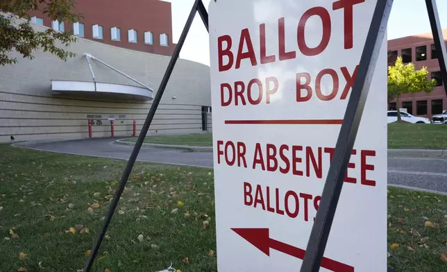 A drop slot for voting ballots and absentee applications is shown outside of the Warren City Hall complex Thursday, Oct. 24, 2024, in Warren, Mich. (AP Photo/Paul Sancya)