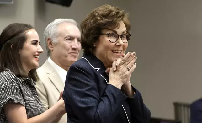 Sen. Jacky Rosen, left, D-Nev., gives a victory speech at the Teamsters Local 631 meeting hall Saturday, Nov. 9, 2024, in Las Vegas. Listening at left are her daughter Miranda Rosen and husband Larry Rosen. (Steve Marcus/Las Vegas Sun via AP)