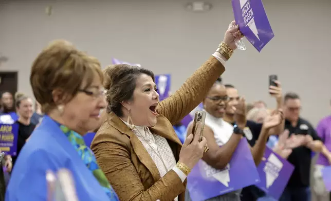 Maritza Rodriguez, center, cheers as Sen. Jacky Rosen, D-Nev., arrives to give a victory speech at the Teamsters Local 631 meeting hall Saturday, Nov. 9, 2024, in Las Vegas. (Steve Marcus/Las Vegas Sun via AP)