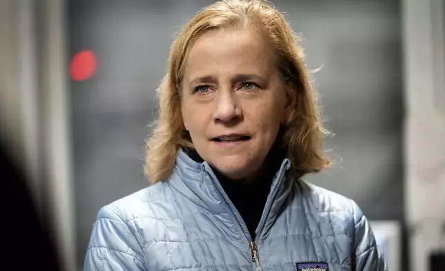 FILE — Joyce Craig, Democratic candidate for governor, speaks with workers during a visit to the Milan Lumber mill, Wednesday, Oct. 16, 2024, in Milan, N.H. (AP Photo/Robert F. Bukaty, File)