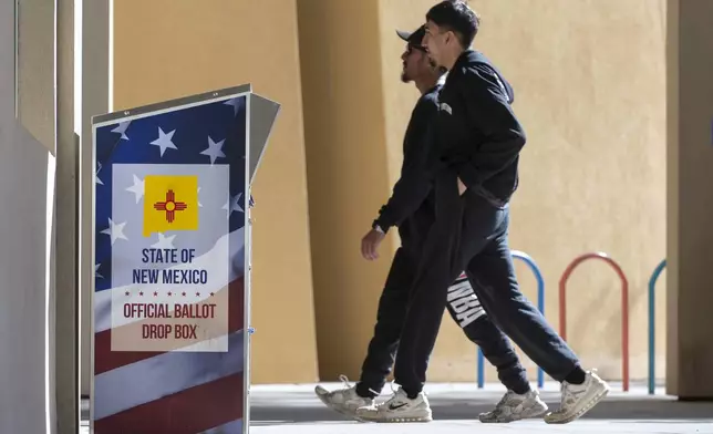 People enter Las Cruces, N.M., City Hall to cast their ballots on Election Day, Tuesday, Nov. 5, 2024. (Eddie Moore/The Albuquerque Journal via AP)