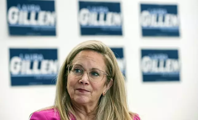 Laura Gillen, Democratic candidate for New York's 4th Congressional District, listens during a roundtable discussion outlining her policy platform to lower healthcare costs for Latino families, Thursday, Oct. 24, 2024, in Freeport, N.Y. (AP Photo/Heather Khalifa)