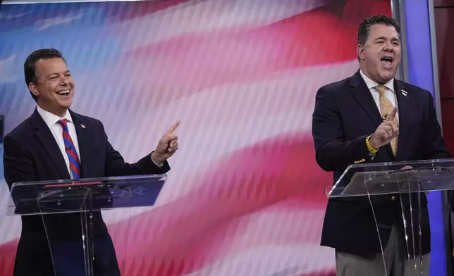 Democratic candidate, John Avlon, left, and Rep. Nick LaLota, R-N.Y. debate for New York's 1st Congressional District, Wednesday, Oct. 23, 2024, in Bethpage, N.Y. (AP Photo/Frank Franklin II)