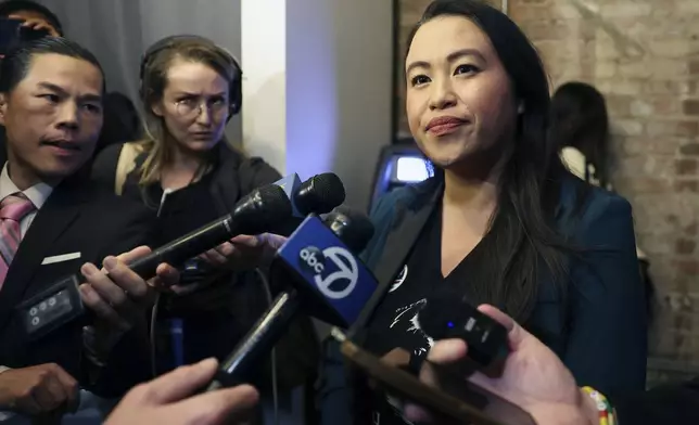 Oakland Mayor Sheng Thao, right, listens to a question from the media during an election night gathering at Fluid 510 in Oakland, Calif., Tuesday, Nov. 5, 2024. (Scott Strazzante/San Francisco Chronicle via AP)