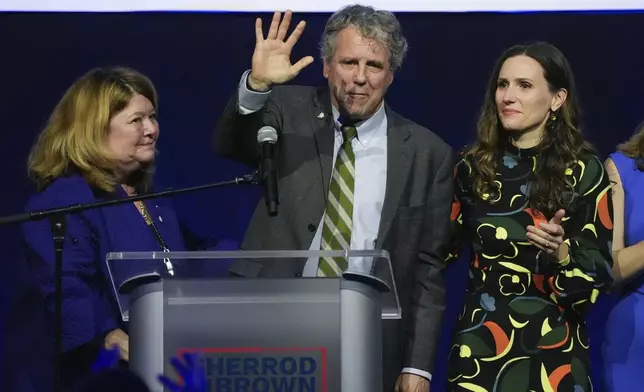 Democratic Ohio Sen. Sherrod Brown speaks during a watch party on election night, Tuesday, Nov. 5, 2024, in Columbus, Ohio, next to his wife Connie Schultz, left, and his daughter Elizabeth Brown, right. (AP Photo/Joshua A. Bickel)