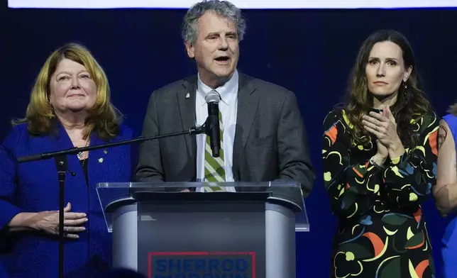 Democratic Ohio Sen. Sherrod Brown speaks during a watch party on election night, Tuesday, Nov. 5, 2024, in Columbus, Ohio, next to his wife Connie Schultz, left, and his daughter Elizabeth Brown, right.(AP Photo/Joshua A. Bickel)