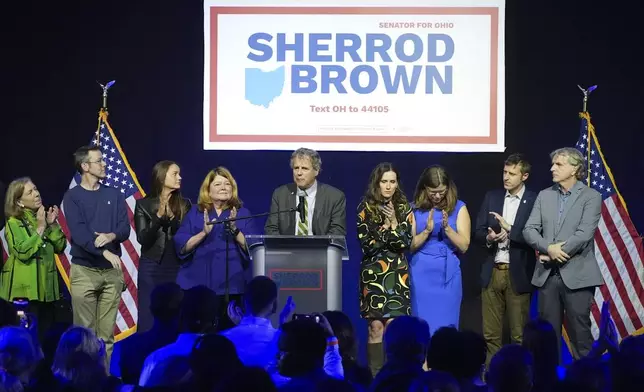 Democratic Ohio Sen. Sherrod Brown speaks during a watch party on election night, Tuesday, Nov. 5, 2024, in Columbus, Ohio, next to his wife Connie Schultz, left, and his daughter Elizabeth Brown, right, and others. (AP Photo/Joshua A. Bickel)