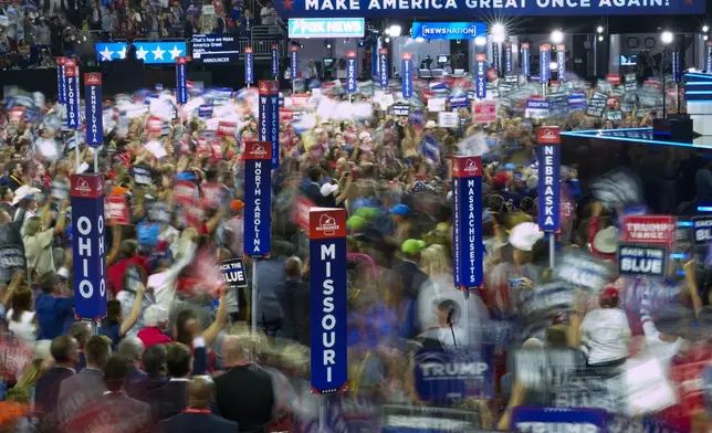 The floor of the Fiserv Forum is seen with a slow shutter speed during the Republican National Convention Tuesday, July 16, 2024, in Milwaukee. (AP Photo/Charles Rex Arbogast)