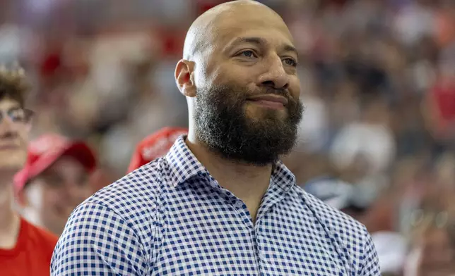 FILE - Royce White, candidate for U.S. Senate, listens as Republican presidential candidate former President Donald Trump speaks at a campaign rally, July 27, 2024, in St. Cloud, Minn. (AP Photo/Alex Brandon, File)