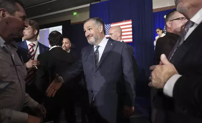 Sen. Ted Cruz, R-Texas, shakes hands during a watch party on election night, Tuesday, Nov. 5, 2024, at the Marriott Marquis in Houston. (AP Photo/LM Otero)