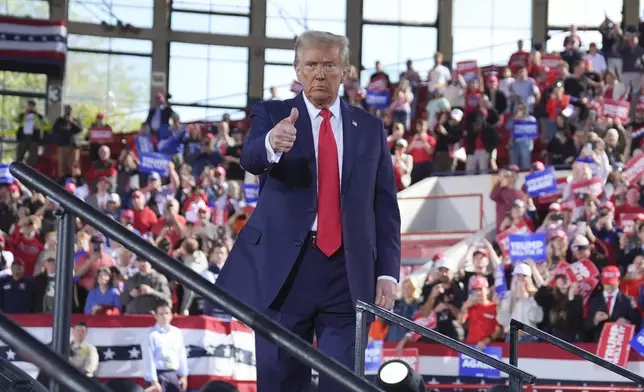 Republican presidential nominee former President Donald Trump wraps up a campaign rally at J.S. Dorton Arena, Monday, Nov. 4, 2024, in Raleigh, N.C. (AP Photo/Evan Vucci)