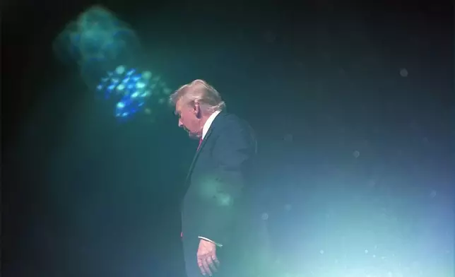 Republican presidential nominee former President Donald Trump departs after a Tucker Carlson Live Tour show at Desert Diamond Arena, Thursday, Oct. 31, 2024, in Glendale, Ariz. (AP Photo/Julia Demaree Nikhinson)