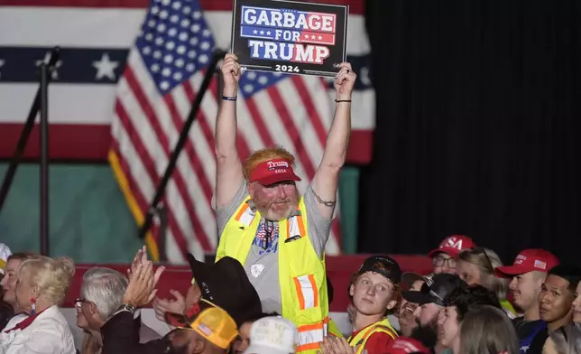 Supports for Republican presidential nominee former President Donald Trump show their support before Trump arrives to speak at a campaign rally at First Horizon Coliseum, Saturday, Nov. 2, 2024, in Greensboro, NC. (AP Photo/Alex Brandon)