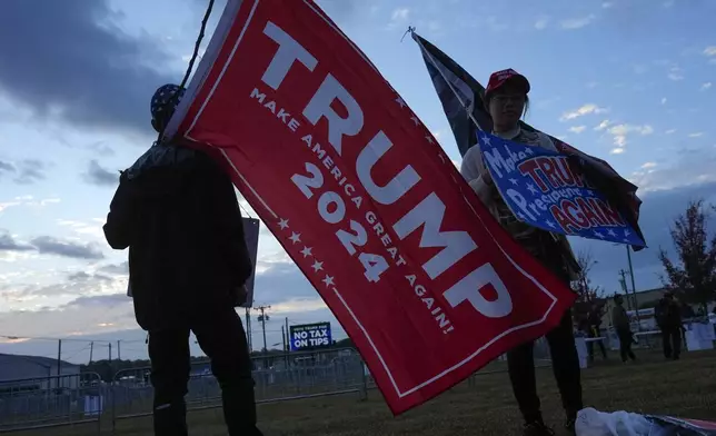 Supporters arrive before Republican presidential nominee former President Donald Trump speaks at a campaign rally in Gastonia, N.C., Saturday, Nov. 2, 2024. (AP Photo/Chris Carlson)