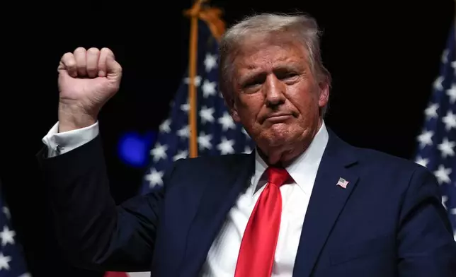 Republican presidential nominee former President Donald Trump gestures after a Tucker Carlson Live Tour show at Desert Diamond Arena, Thursday, Oct. 31, 2024, in Glendale, Ariz. (AP Photo/Julia Demaree Nikhinson)