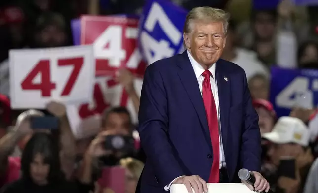 Republican presidential nominee former President Donald Trump smiles at a town hall in Lancaster, Pa., Sunday, Oct. 20, 2024. (AP Photo/Susan Walsh)