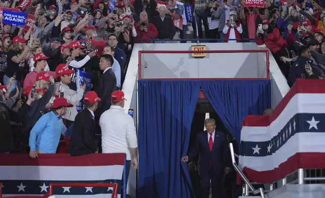 Republican presidential nominee former President Donald Trump arrives to speak at a campaign rally at J.S. Dorton Arena, Monday, Nov. 4, 2024, in Raleigh, N.C. (AP Photo/Evan Vucci)