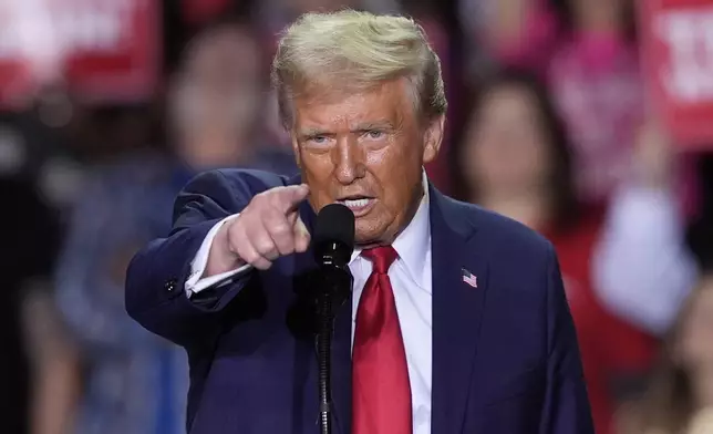 Republican presidential nominee former President Donald Trump speaks at a campaign rally at Van Andel Arena, Tuesday, Nov. 5, 2024, in Grand Rapids, Mich. (AP Photo/Carlos Osorio)