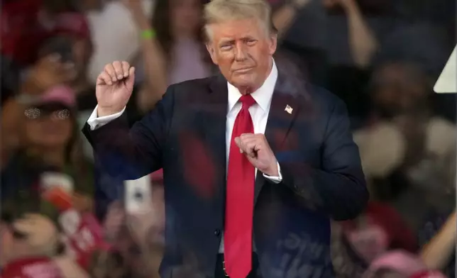 Republican presidential nominee former President Donald Trump dances at a campaign rally in Gastonia, N.C., Saturday, Nov. 2, 2024. (AP Photo/Chris Carlson)