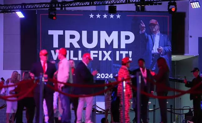 Supporters arrive at an election night watch party for Republican presidential nominee former President Donald Trump Tuesday, Nov. 5, 2024, in West Palm Beach, Fla. (AP Photo/Julia Demaree Nikhinson)