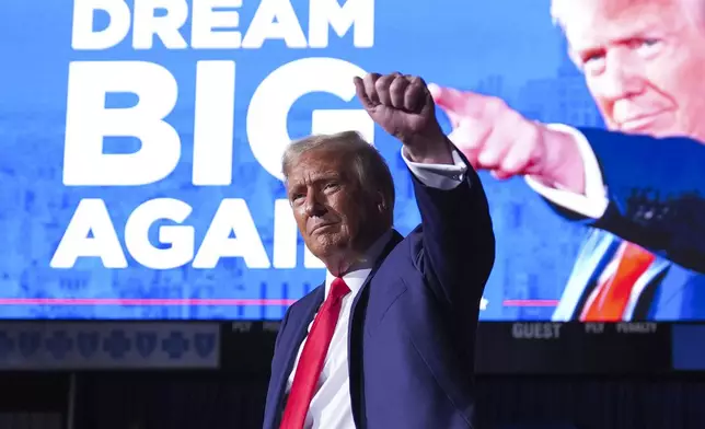 Republican presidential nominee former President Donald Trump gestures at a campaign rally at Van Andel Arena, Tuesday, Nov. 5, 2024, in Grand Rapids, Mich. (AP Photo/Evan Vucci)