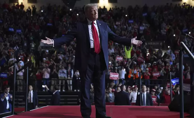 Republican presidential nominee former President Donald Trump arrives at a campaign rally at the Salem Civic Center, Saturday, Nov. 2, 2024, in Salem, Va. (AP Photo/Evan Vucci)