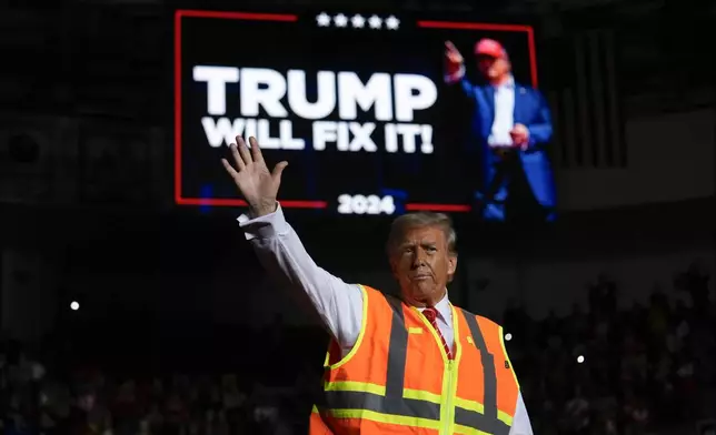 Republican presidential nominee former President Donald Trump waves after speaking at a campaign rally at Resch Center, Wednesday, Oct. 30, 2024, in Green Bay, Wis. (AP Photo/Julia Demaree Nikhinson)