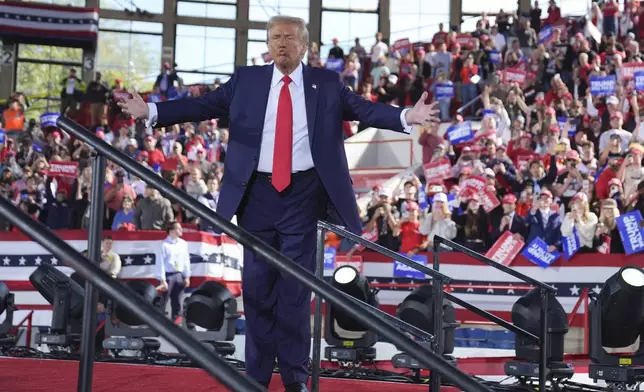 Republican presidential nominee former President Donald Trump wraps up a campaign rally at J.S. Dorton Arena, Monday, Nov. 4, 2024, in Raleigh, N.C. (AP Photo/Evan Vucci)