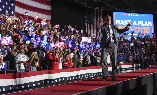 Robert F. Kennedy Jr., arrives before Republican presidential nominee former President Donald Trump at a campaign rally at Macomb Community College, Friday, Nov. 1, 2024, in Warren, Mich. (AP Photo/Julia Demaree Nikhinson)