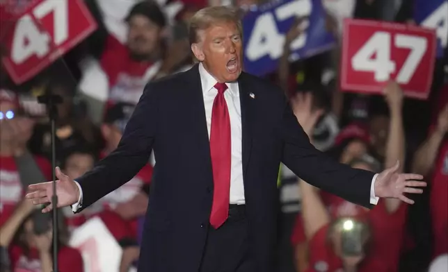 Republican presidential nominee former President Donald Trump arrives at a campaign rally at Macomb Community College Friday, Nov. 1, 2024, in Warren, Mich. (AP Photo/Paul Sancya)