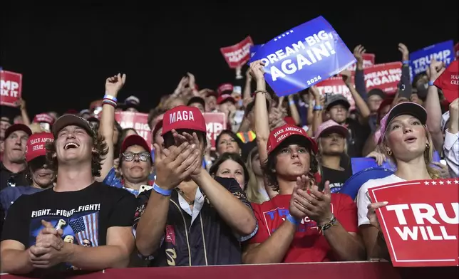 Supporters wait for Republican presidential nominee former President Donald Trump to arrive for a campaign rally at the Salem Civic Center, Saturday, Nov. 2, 2024, in Salem, Va. (AP Photo/Evan Vucci)