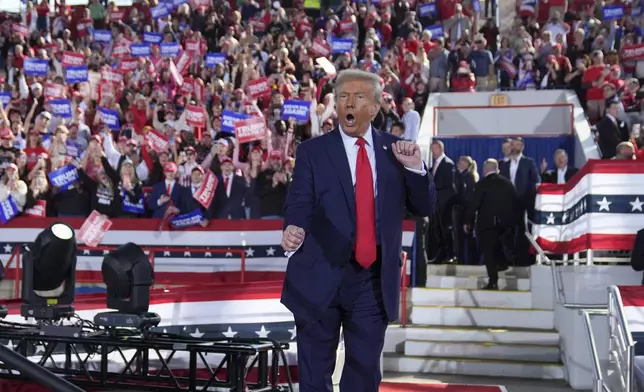 Republican presidential nominee former President Donald Trump wraps up a campaign rally at J.S. Dorton Arena, Monday, Nov. 4, 2024, in Raleigh, N.C. (AP Photo/Evan Vucci)