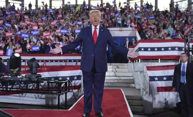 Republican presidential nominee former President Donald Trump arrives to speak at a campaign rally at J.S. Dorton Arena, Monday, Nov. 4, 2024, in Raleigh, N.C. (AP Photo/Evan Vucci)