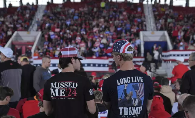 Supporters arrive before Republican presidential nominee former President Donald Trump arrives to speak to a campaign rally at J.S. Dorton Arena, Monday, Nov. 4, 2024, in Raleigh, N.C. (AP Photo/Evan Vucci)