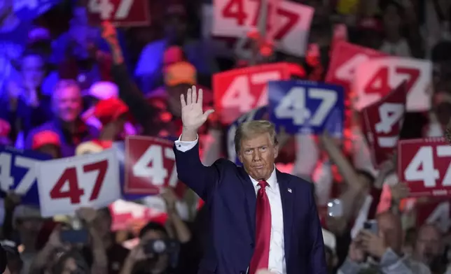 Republican presidential nominee former President Donald Trump waves at a town hall in Lancaster, Pa., Sunday, Oct. 20, 2024. (AP Photo/Susan Walsh)