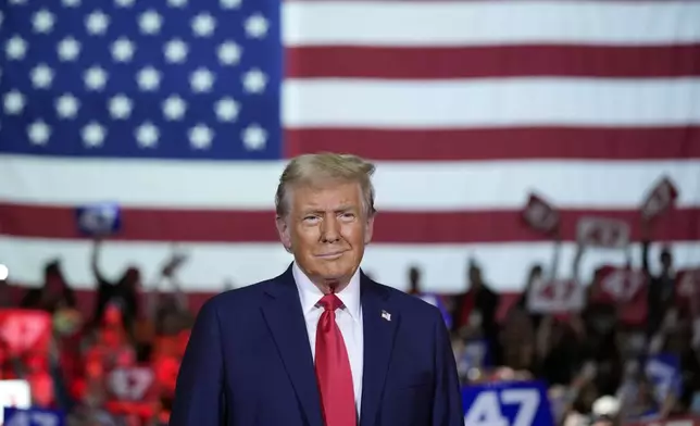 Republican presidential nominee former President Donald Trump arrives at a town hall at Lancaster County Convention Center, Sunday, Oct. 20, 2024, in Lancaster, Pa. (AP Photo/Evan Vucci)