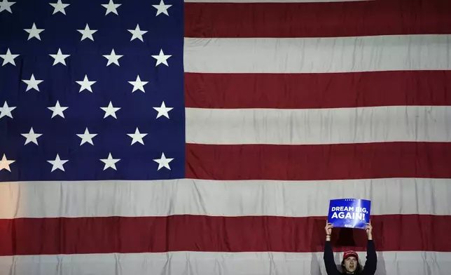 A supporter arrives before Republican presidential nominee former President Donald Trump speaks at a campaign rally at Santander Arena, Monday, Nov. 4, 2024, in Reading, Pa. (AP Photo/Evan Vucci)