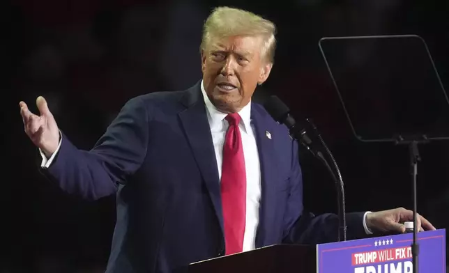 Republican presidential nominee former President Donald Trump speaks at a campaign rally at Van Andel Arena, Tuesday, Nov. 5, 2024, in Grand Rapids, Mich. (AP Photo/Paul Sancya)