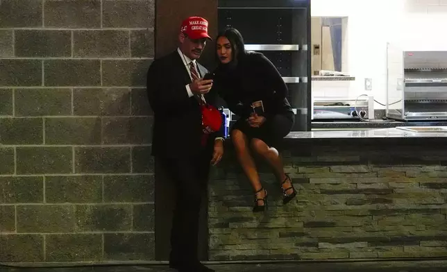 Supporters arrive at an election night watch party for Republican presidential nominee former President Donald Trump Tuesday, Nov. 5, 2024, in West Palm Beach, Fla. (AP Photo/Julia Demaree Nikhinson)