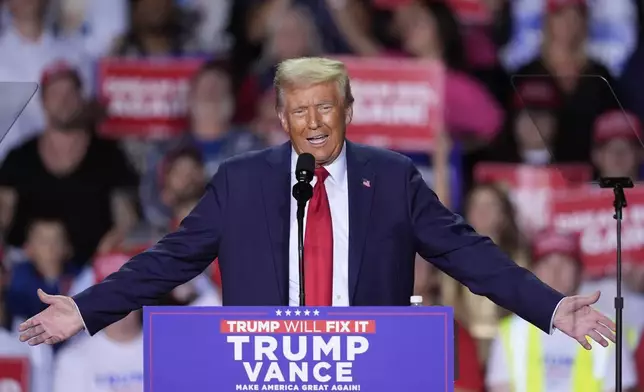 Republican presidential nominee former President Donald Trump speaks at a campaign rally at Van Andel Arena, Tuesday, Nov. 5, 2024, in Grand Rapids, Mich. (AP Photo/Carlos Osorio)